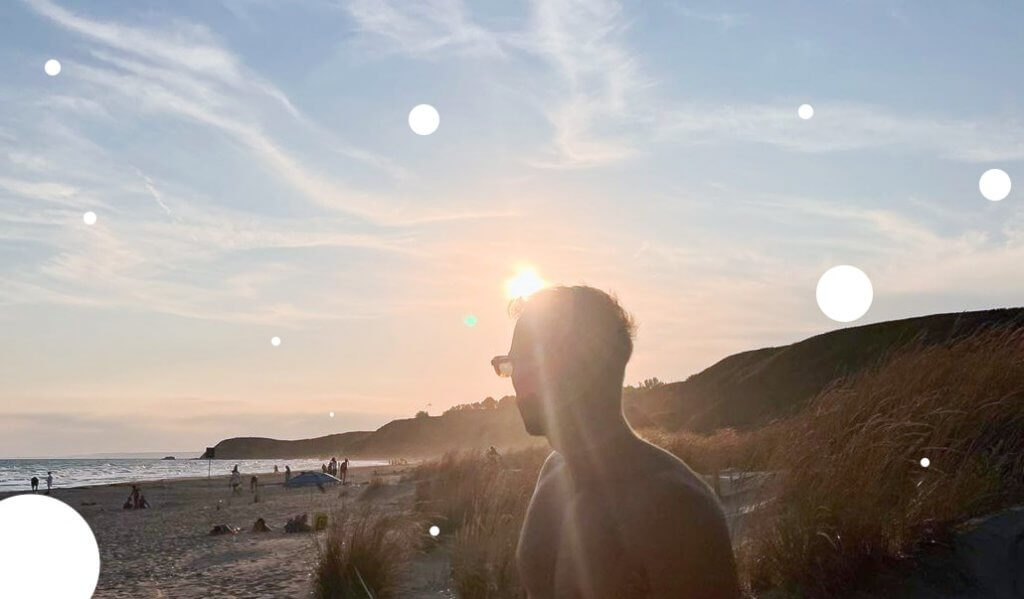 Man quietly staring at the sunset.