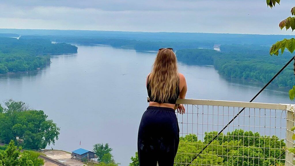 Woman starring at a lake.